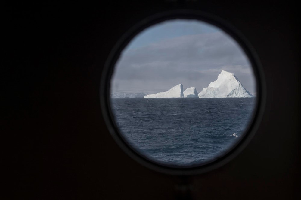 Photography © Christian Åslund / Greenpeace Feature photograph: Icebergs seen through the porthole of Greenpeace ship Esperanza, Antarctica, 2020 In-text photograph: View from the Arctic Sunrise as it transits towards Drake Passage from the Antarctic Peninsula, Antarctica, 2020 